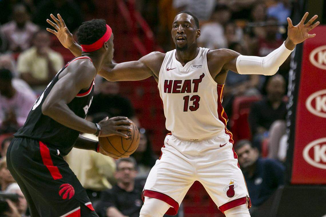 Toronto Raptors forward Pascal Siakam (43) tries to get past Miami Heat center Bam Adebayo (13) during the second quarter of an NBA basketball game at the AmericanAirlines Arena in downtown Miami on Sunday, March 10, 2019.