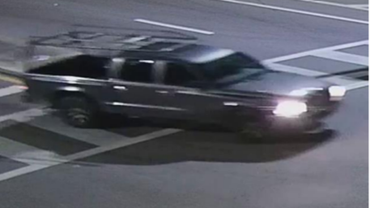 Street cameras show the dark-colored pickup truck that hit a mini scooter Sunday morning.