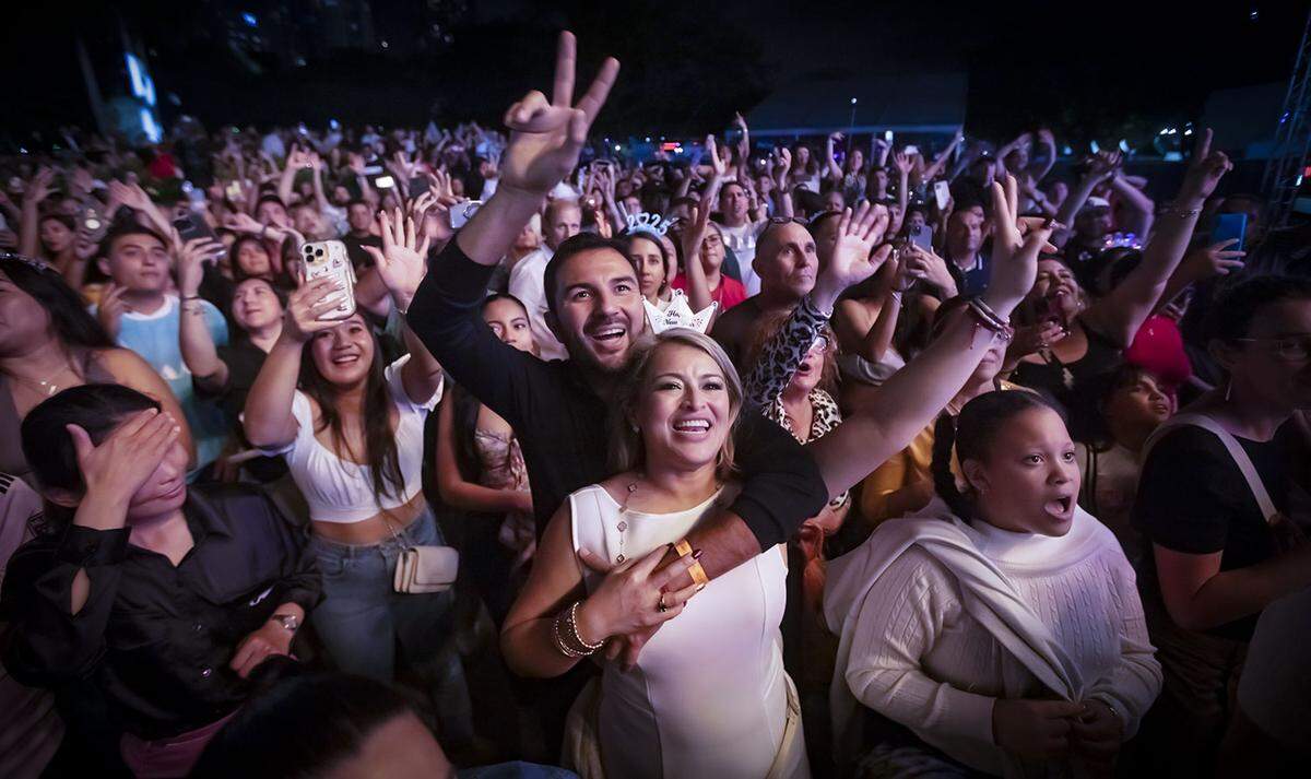 People celebrate during the New Year’s Eve Celebration at Bayfront Park in downtown Miami on December 31, 2024.