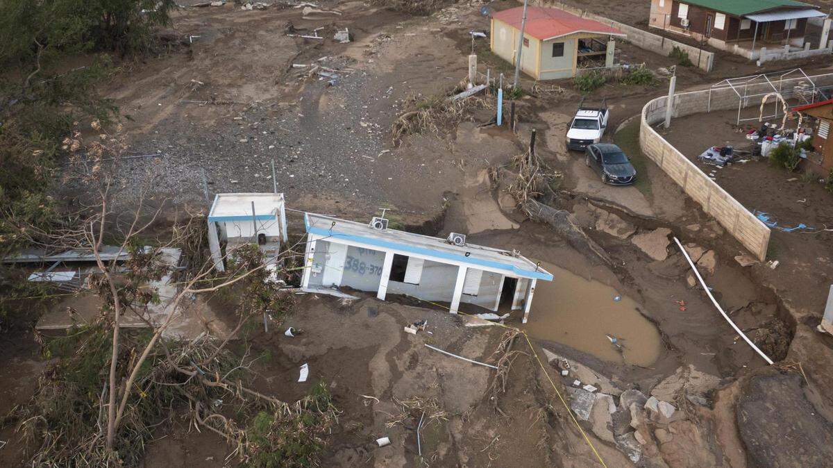 A house rests in the mud after it was washed away by Hurricane Fiona at Villa Esperanza in Salinas, Puerto Rico.