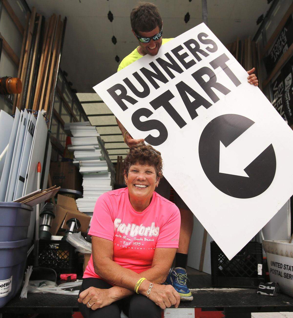 Laurie Huseby, left, and son, JP Huseby, playfully prepare for the 2015 Mercedes-Benz Miami Corporate Run at Bayfront Park, which Laurie and her husband, Hans, started in 1985. The race, which attracts thousands, has expanded to Fort Lauderdale and West Palm Beach. The Husebys own FootWorks in South Miami; Hans died in 2014.