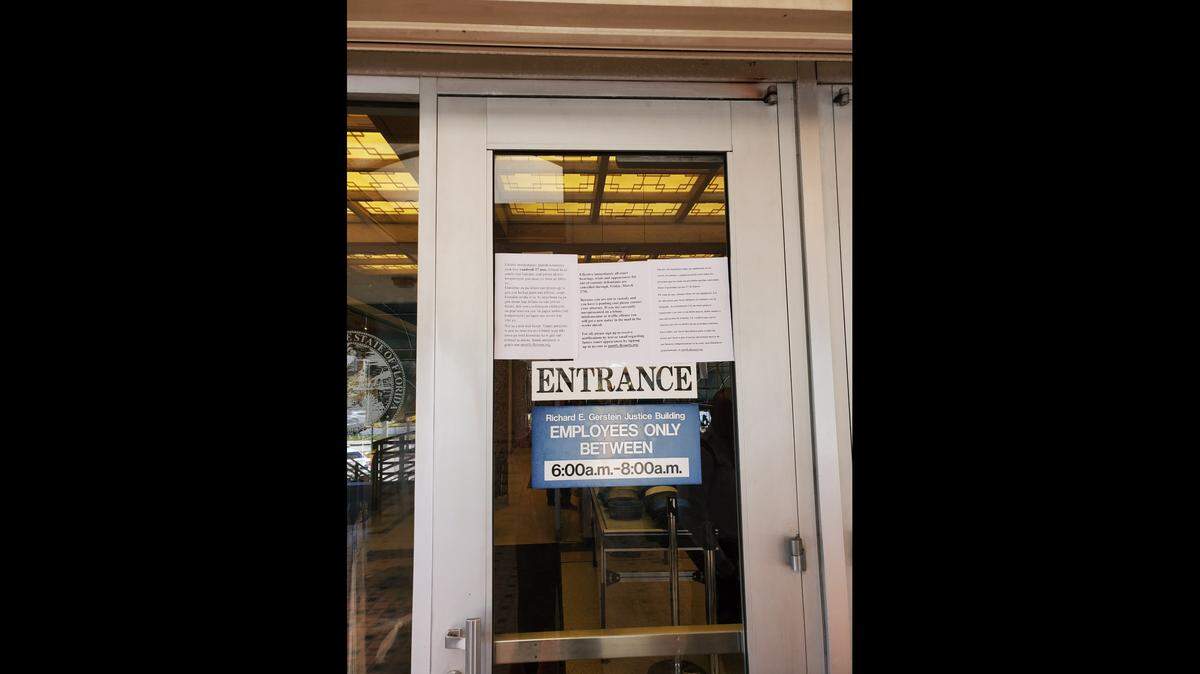 Signs explaining court procedures greeted visitors to the Richard E. Gerstein Justice Building on Monday, March 16, 2020.