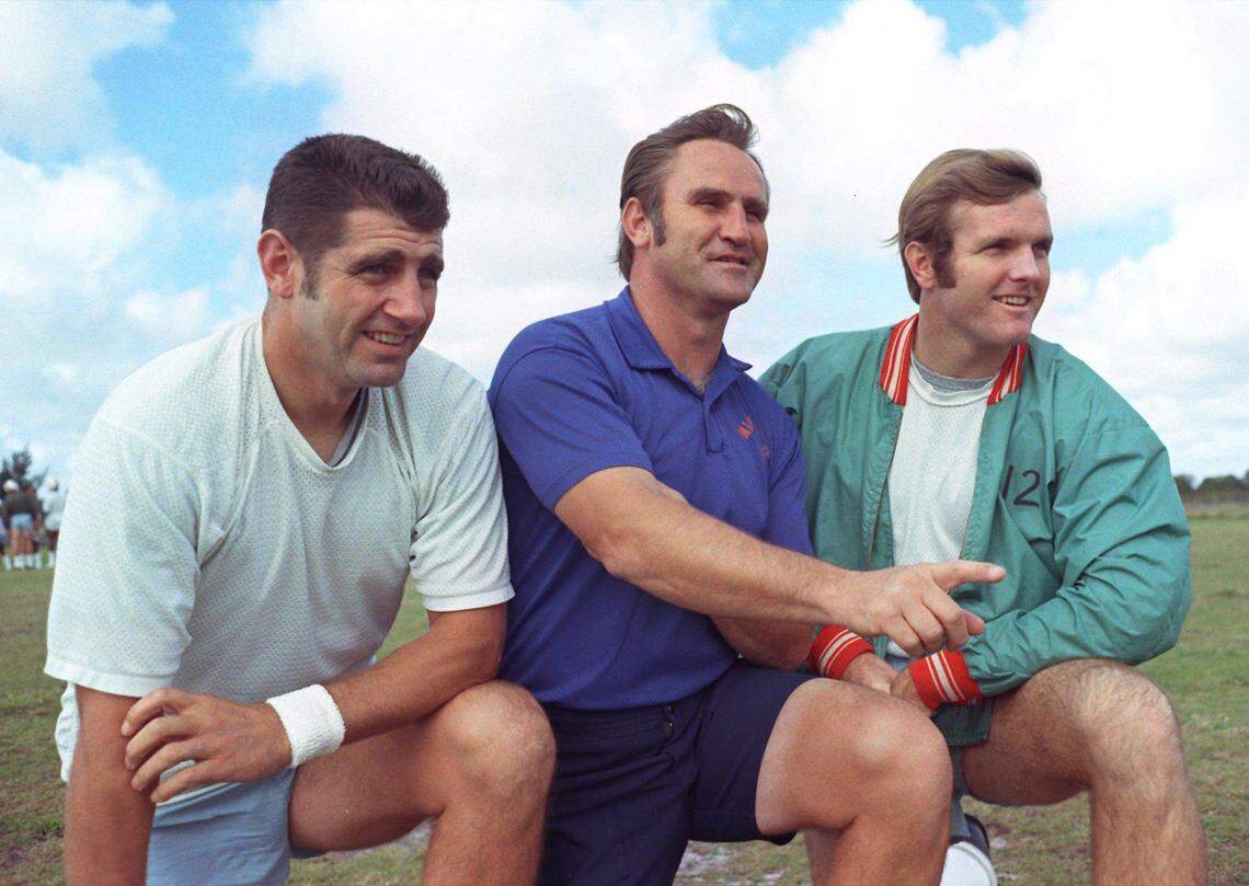 Miami Dolphins coach Don Shula poses with quarterbacks Earl Morrall, left, and Bob Griese, right, on Jan. 3, 1973 in Miami.
