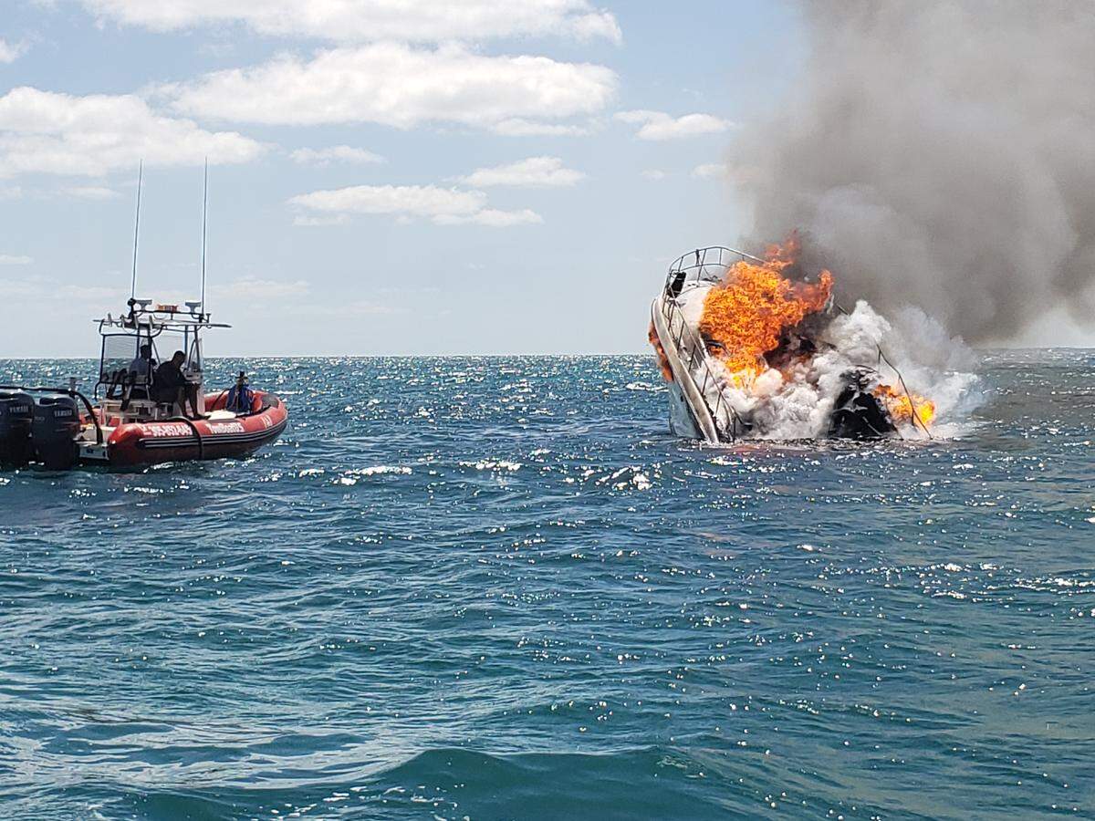 A flaming 38-foot boat sinks off the coast of Islamorada Wednesday afternoon, April 17, 2019. Monroe County Sheriff’s Office photo