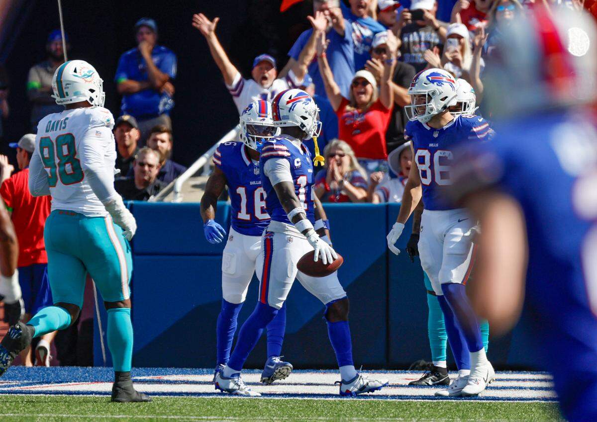 Buffalo Bills wide receiver Stefon Diggs (14) and teammates celebrate in the end zone after scoring against the Miami Dolphins in the first half at Highmark Stadium in Orchard Park, NY., on Sunday, October 1, 2023.