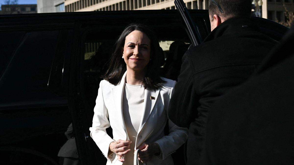 Venezuelan opposition leader Maria Corina Machado exits a vehicle as she arrives near the White House ahead of a meeting with President Donald Trump in Washington, D.C., on Jan. 15, 2026.