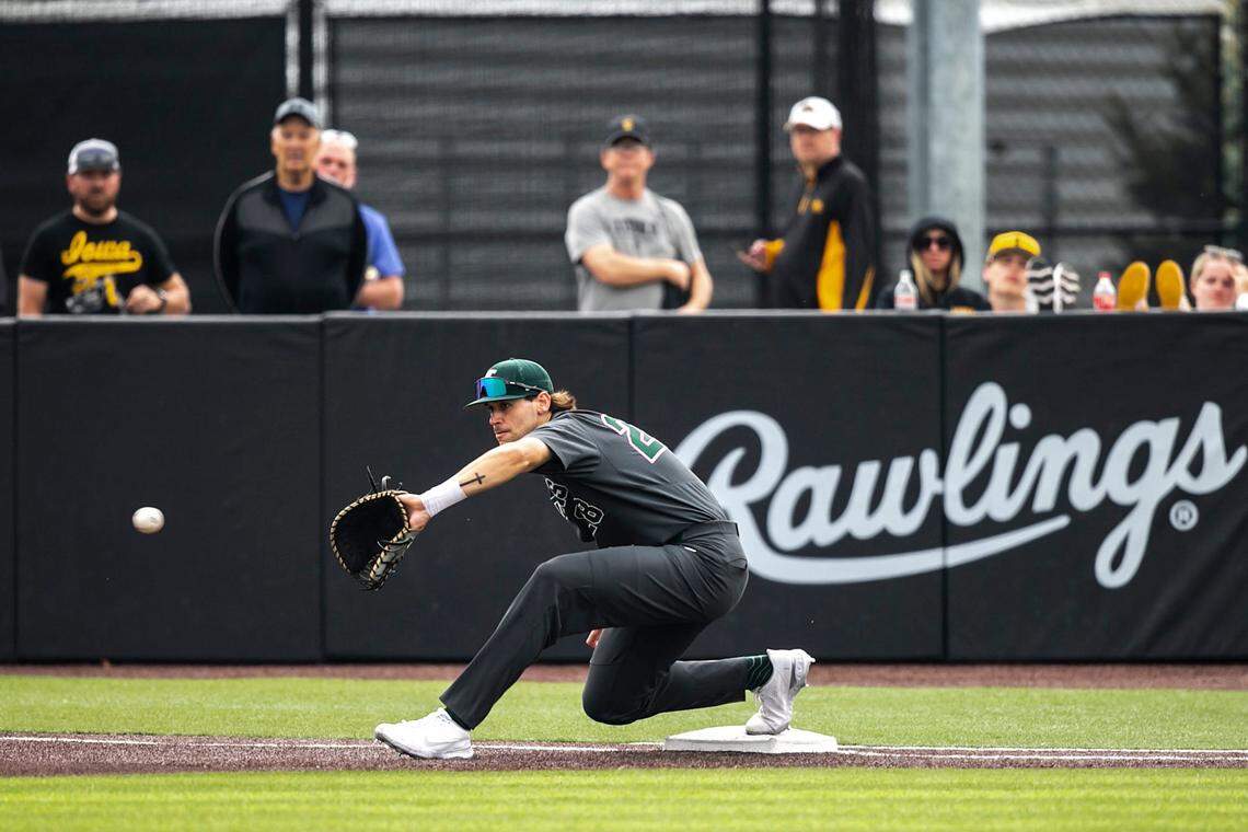 Michigan State’s Brock Vradenburg (28) gets an out at first base during a NCAA Big Ten Conference baseball game against Iowa, Saturday, May 13, 2023, at Duane Banks Field in Iowa City, Iowa.