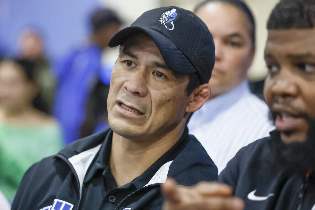 South Dade High wrestling coach Humberto Reyna Jr. watches his team during the GMAC Boys Wrestling Championships at South Dade Senior High School in Homestead, Florida on Friday, February 6, 2026.