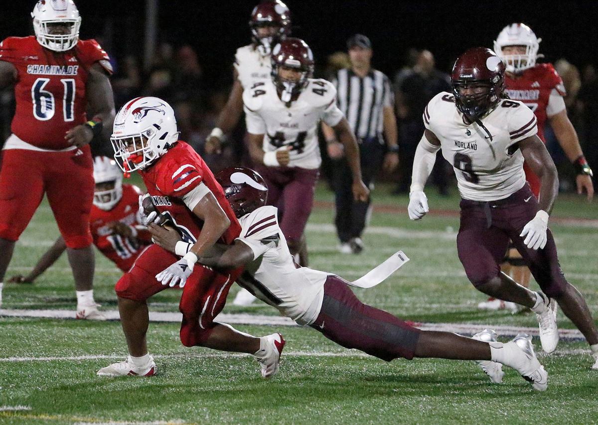 Chaminade-Madonna Lions Kyle Washington is tackled by Norland Vikings defender during football game on Thursday, September 19, 2024 at Chaminade_Madonna HS in Hollywood. Andrew Uloza / for Miami Herald