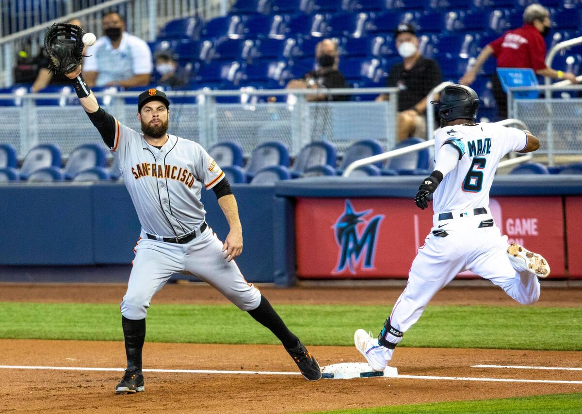 Miami Marlins outfielder Starling MarteÂ&nbsp;(6) is called safe at first base during the first inning of an MLB game against the San Francisco Giants at loanDepot park in the Little Havana neighborhood of Miami, Florida, on Sunday, April 18, 2021.
