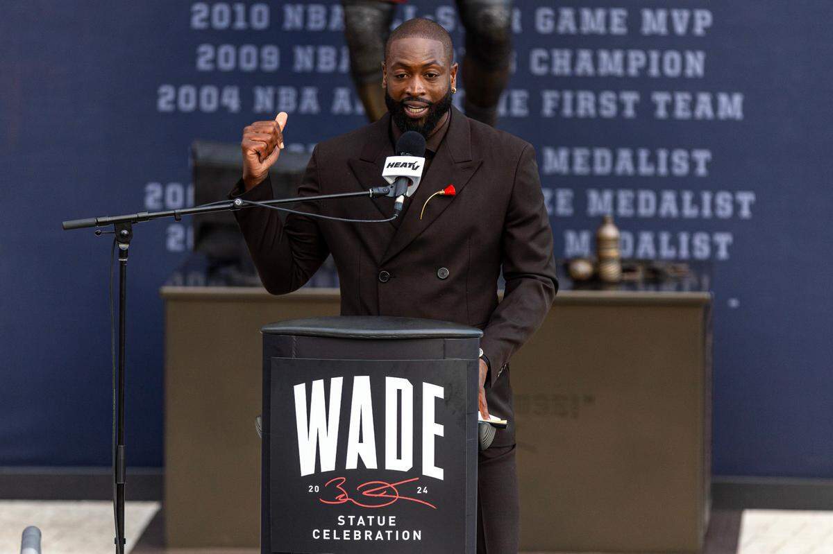 Heat icon Dwyane Wade speaks during the unveiling ceremony of his statue in front of the Kaseya Center on October 27, 2024, in Miami.