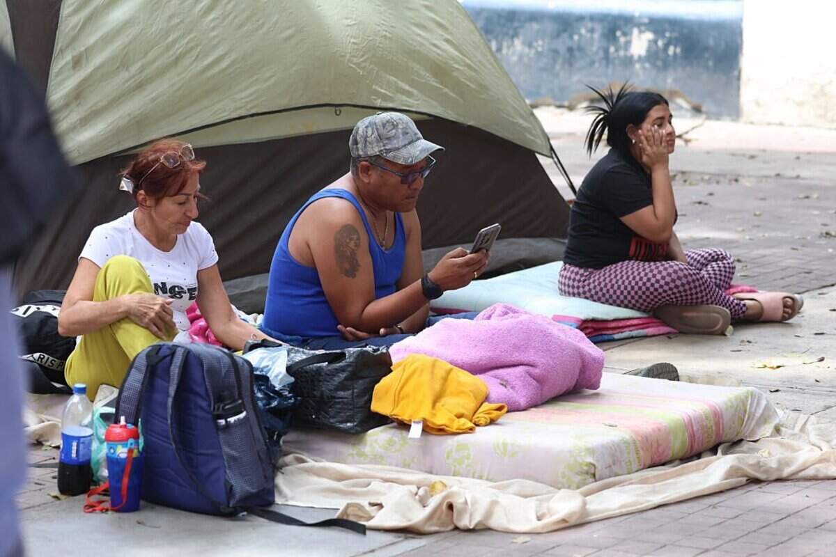 CARACAS, VENEZUELA - JUNE 25: Residents sit beside belongings as they take shelter on a street after a magnitude 7.2 earthquake struck Venezuela and other regions in the Caribbean on June 25, 2026 in Caracas, Venezuela. According to the U.S. Geological Survey (USGS), the main earthquake was followed by a 7.5-magnitude aftershock less than a minute later. The number of victims increased to 164 and over a thousand injured. (Photo by Edilzon Gamez/Getty Images)