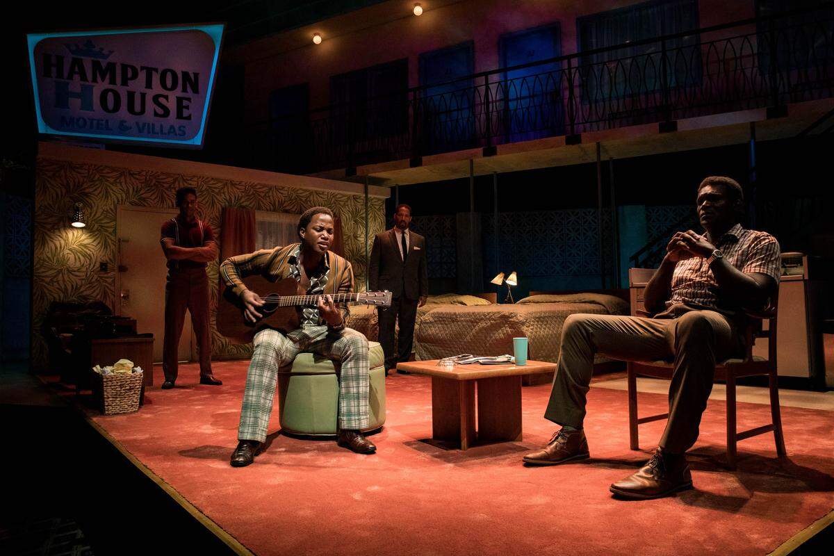 Kieron Anthony, Jason Delane and Esau Pritchett surround Leon Thomas III’s Sam Cooke as he sings “A Change Is Gonna Come” in “One Night in Miami.”