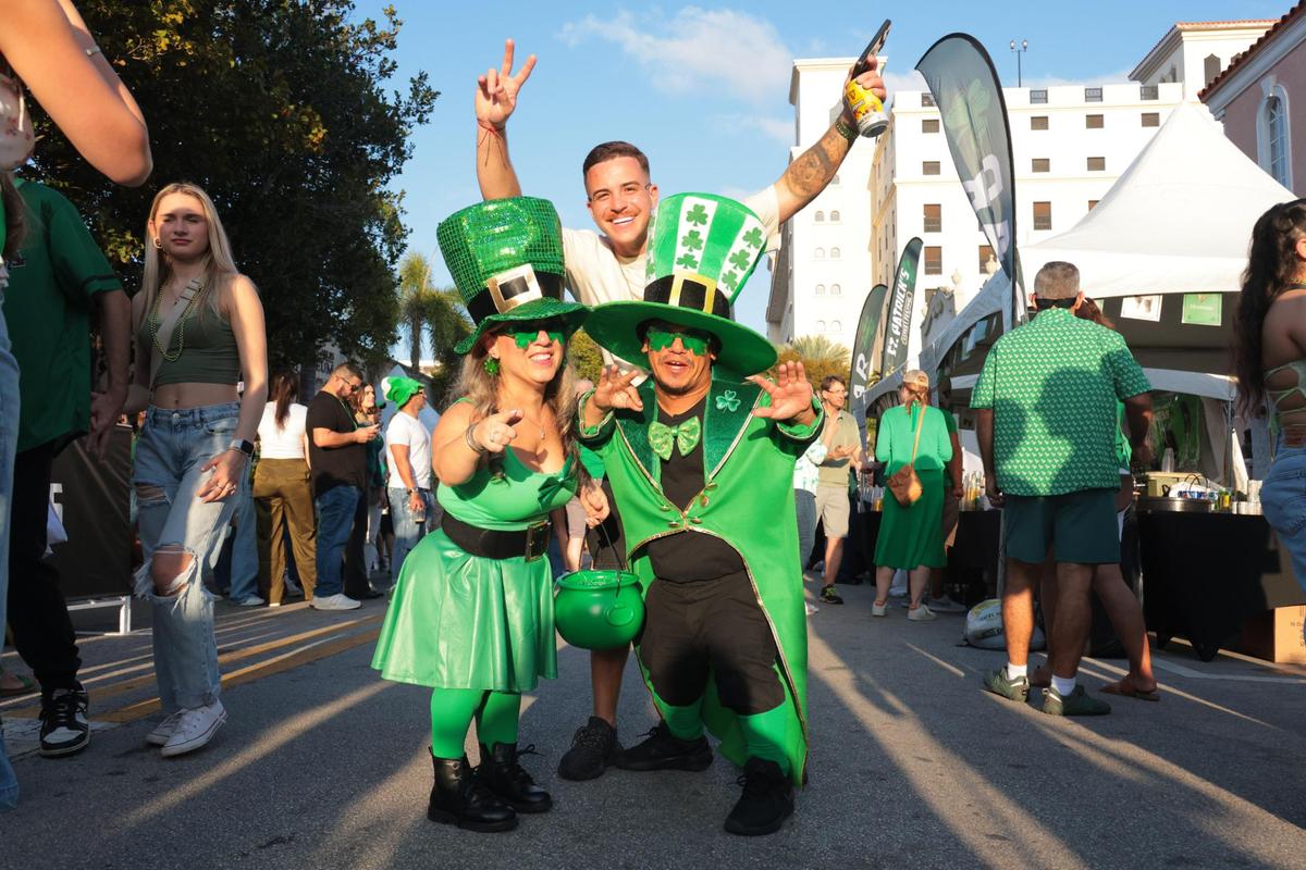 Sandra Ramos, left, and Jonathan Mercado, right, pose for a photo during the John Martin’s 32nd Annual St. Patrick’s Day Street Festival in Coral Gables, Florida, Saturday, March 15, 2025.