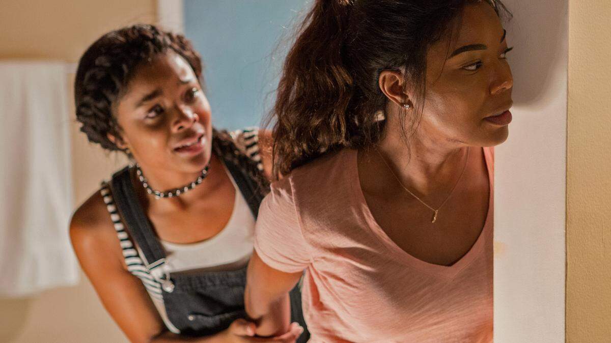 From left, Jasmine (Ajiona Alexus) and mom Shaun (Gabrielle Union) in the film, "Breaking In." (Paul Sarkis/Universal Studios)