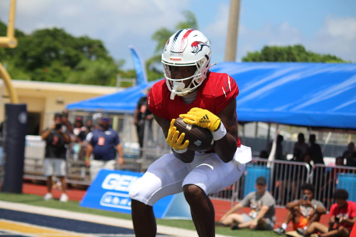 Chaminade wide receiver Jeremiah Smith leaps to make a touchdown catch during the Lions’ 35-14 win over St. Frances Academy on Saturday at St. Thomas Aquinas.