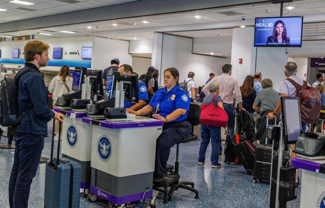 TSA agents check in passengers on Wednesday, May 7, 2025.
