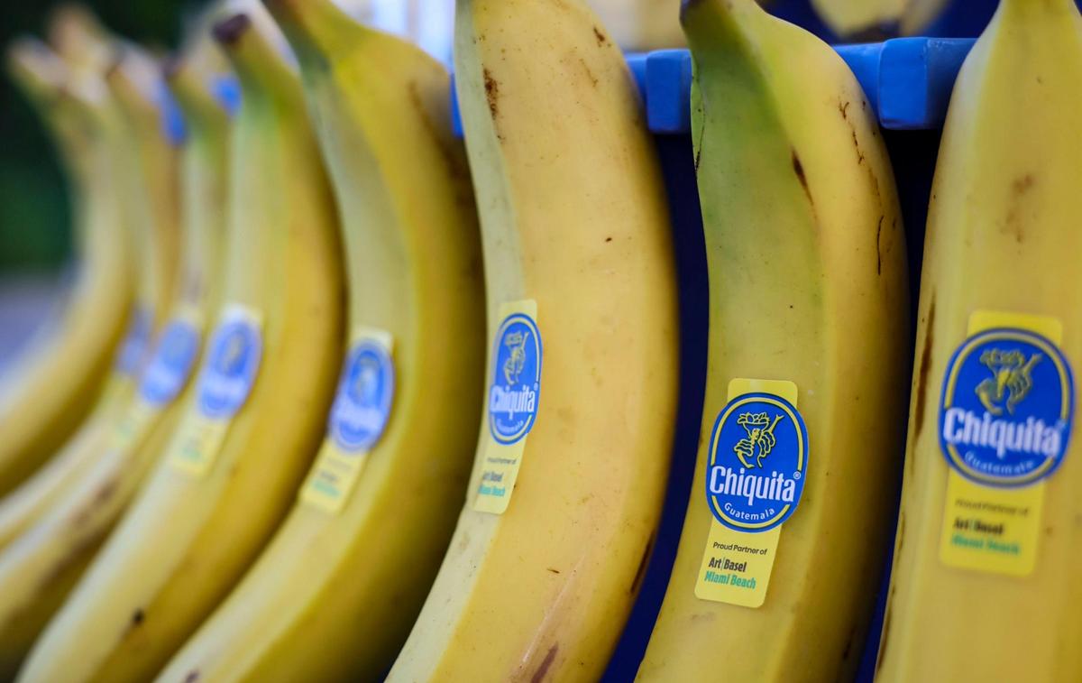 Bananas are on display at a Chiquita booth during Art Basel at the Miami Beach Convention Center on Wednesday, Dec. 4, 2024, in Miami Beach, Fla.