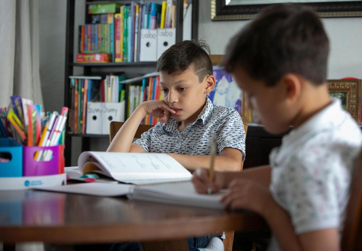 Gabriel Rodriguez-Sánchez, 10, and his brother, Samuel, 7, did most of their schooling last year during the pandemic at their dining room table in the family’s Miramar home.