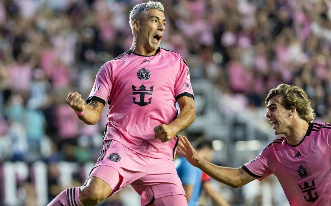 Inter Miami forward Luis Suárez (9) celebrates with midfielder Benjamin Cremaschi (30) after scoring a goal against the New England Revolution in the first half of their MLS match at Chase Stadium on Saturday, Oct. 19, 2024, in Fort Lauderdale, Fla.