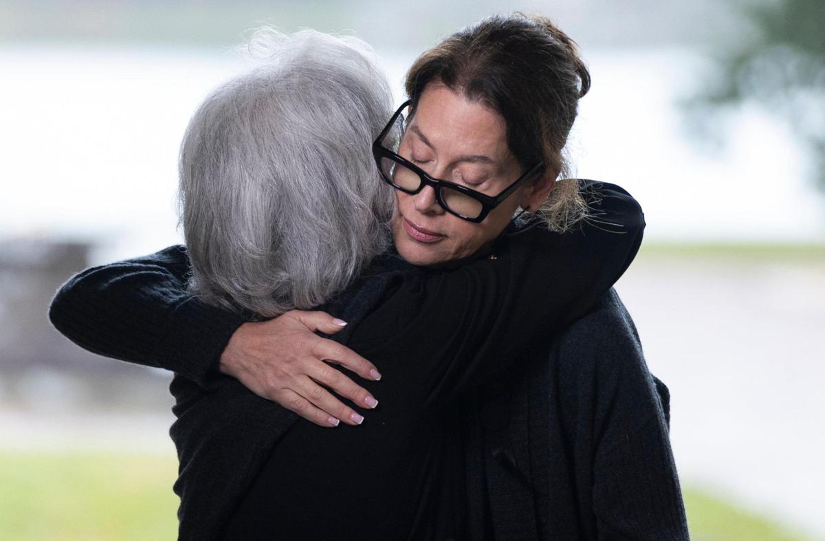 Michelle Breger, daughter of Sam Moore, hugs her mom, Joyce Moore, during her father’s funeral service at Lakeside Memorial Park and Funeral Home on Friday, Jan. 17, 2025, in Doral, Fla. Moore, the R&B singer from the famed 1960s duo Sam & Dave, died on Friday, Jan. 10, at the age of 89.