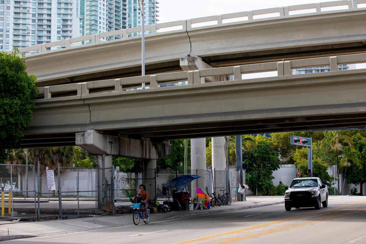 Makeshift beds and living quarters can be seen underneath the I-95 expressway off Southwest 1st street and Southwest Second Avenue in Miami, Florida, on Monday, September 20, 2021.