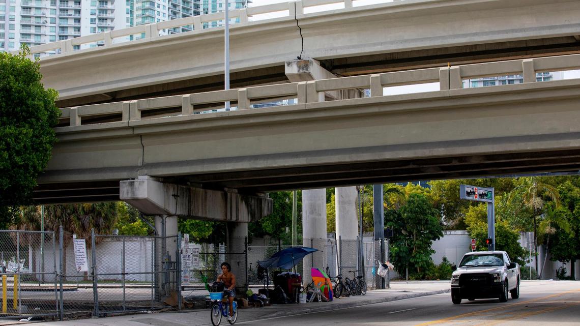 Makeshift beds and living quarters can be seen underneath Interstate 95 near Southwest First Street in September.