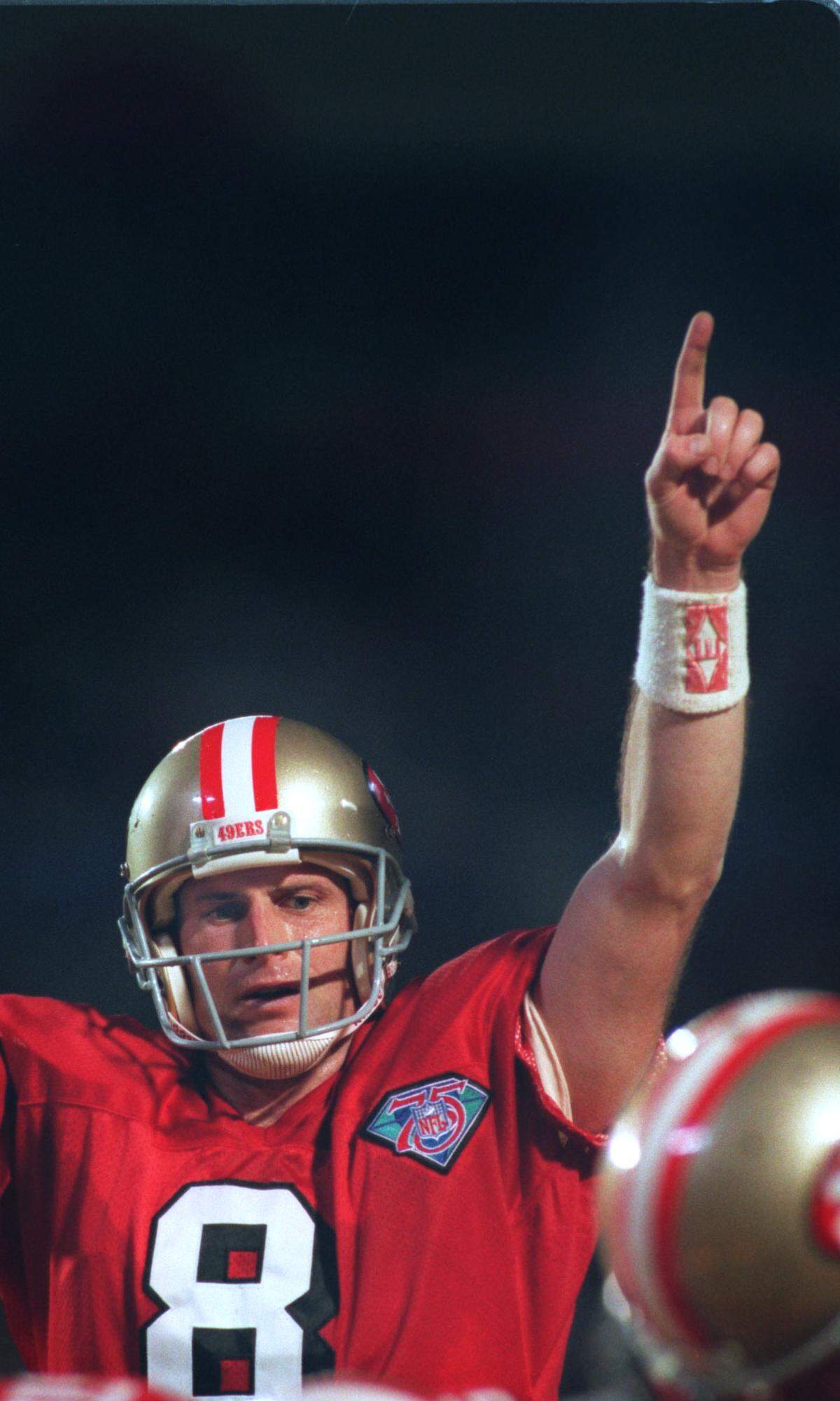 At Super Bowl 29 at Joe Robbie Stadium, Steve Young celebrates his third touchdown pass in the game.
