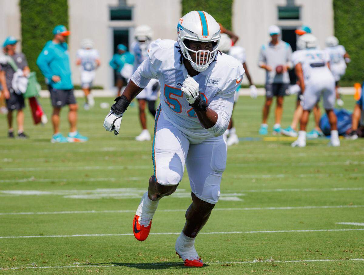 Miami Dolphin’s offensive tackle Patrick Paul (52) runs a drill during Miami Dolphins Training Camp on Monday, July 29, 2024, at Baptist Health Training Complex in Miami Gardens.