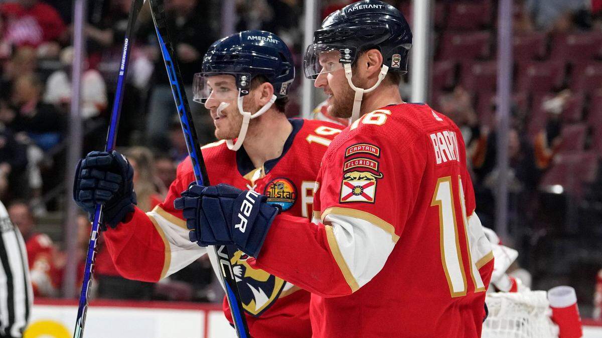 Florida Panthers left wing Matthew Tkachuk (19) celebrates with center Aleksander Barkov (16) after scoring a goal during the second period of an NHL hockey game against the Columbus Blue Jackets, Tuesday, Dec. 13, 2022, in Sunrise, Fla.