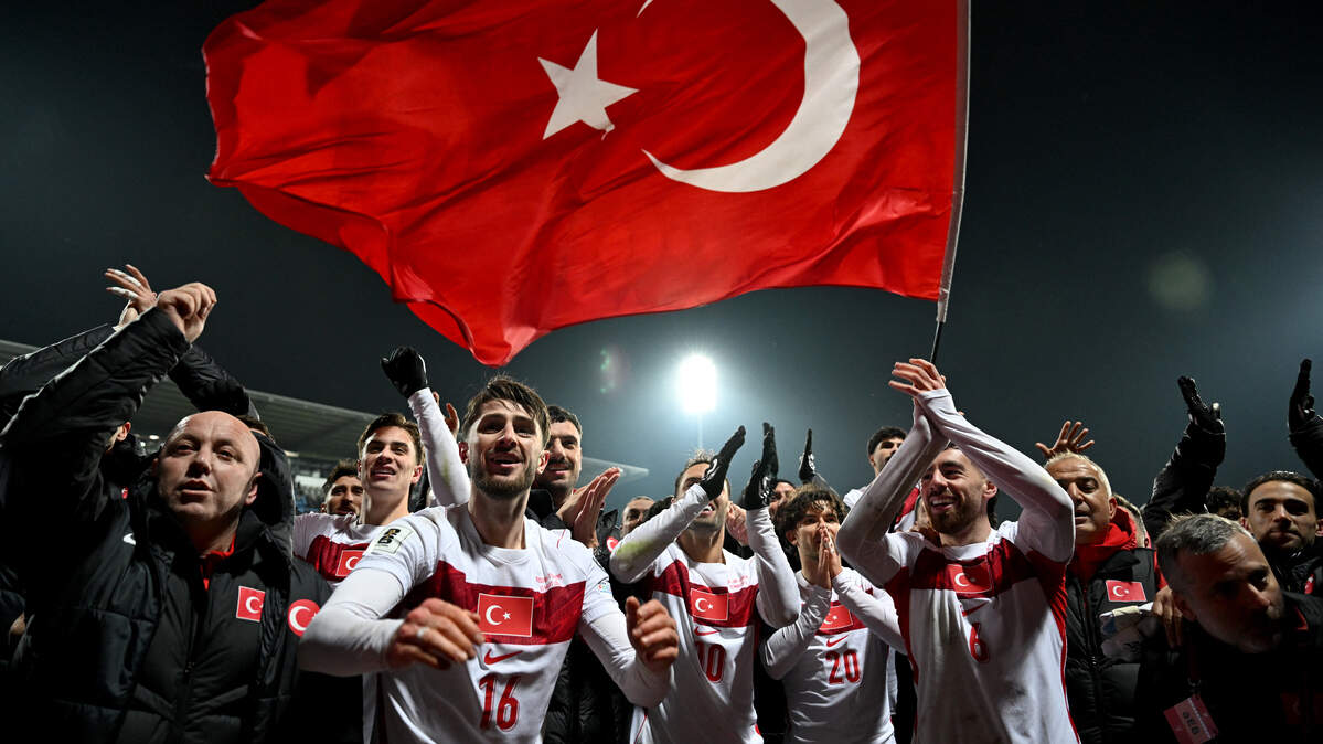 Turkey's players celebrate after winning at the end of the FIFA World Cup 2026 European qualification final football match between Kosovo and Turkey at the Fadil Vokrri stadium in Pristina on March 31, 2026. (Photo by Armend NIMANI / AFP via Getty Images)