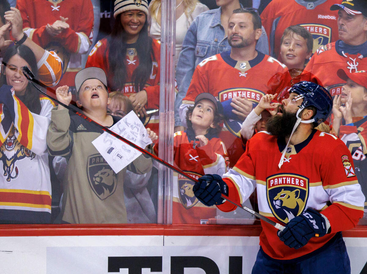 Florida Panthers defenseman Radko Gudas (7) gives a puck to a fan before the start of an NHL game against the Toronto Maple Leafs at the FLA Live Arena on Saturday, April 23, 2022 in Sunrise, Fl.
