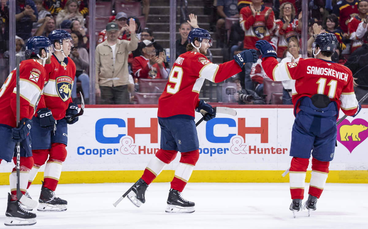 Florida Panthers center Cole Schwindt (79) celebrates with right wing MacKie Samoskevich (11) after scoring against the Detroit Red Wings in the third period of their NHL game at the Amerant Bank Arena on Wednesday, April 15, 2026, in Sunrise, Fla.