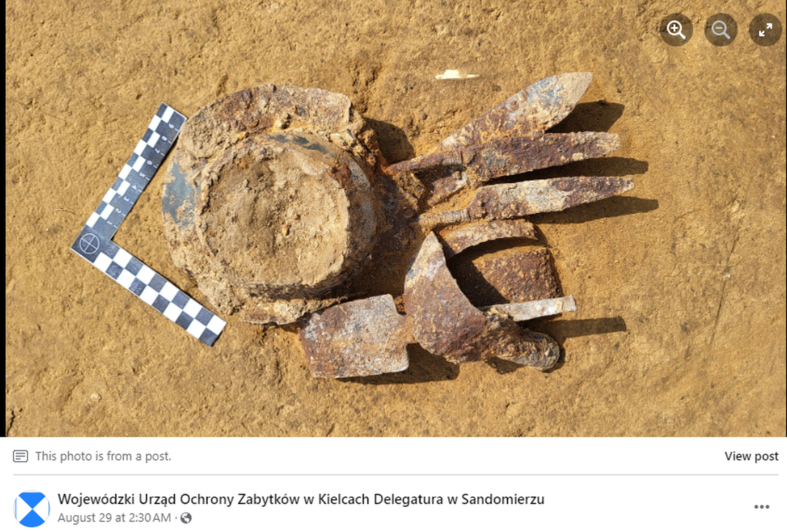 The pit graves were filled with burned human remains and charred weaponry, officials said.