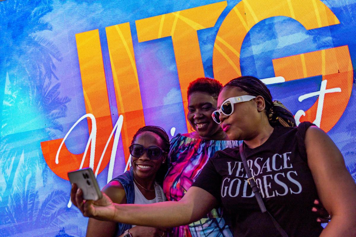 Festival goers Otilia Fritz, Islande Youth and Danielle Fleurme take a selfie during Jazz in the Gardens at Hard Rock Stadium Arena in Miami Gardens, Florida, on Saturday, March 9, 2024.