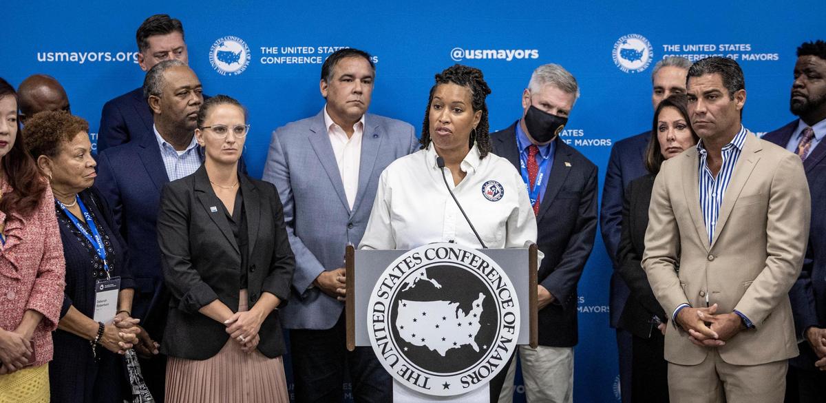 Muriel Bowser, center, the Mayor of Washington, D.C., answers questions from reporters during a press conference at the Hilton Miami Downtown on Friday, Sept. 16, 2022. Miami Mayor Francis Suarez, who also serves as the president of the U.S. Conference of Mayors is at right.