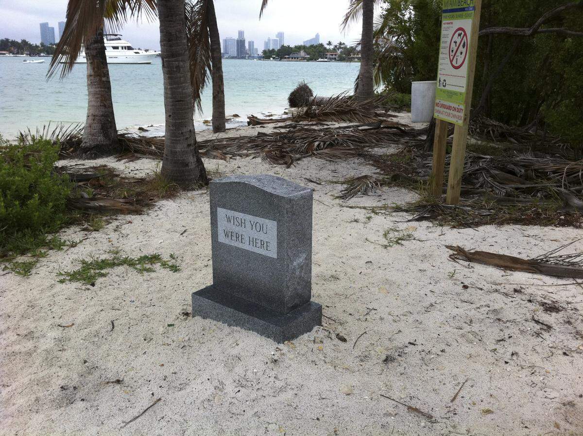 This tombstone, left on Monument Island for weeks after an art bash, is just one of the random pieces of evidence of the parties that are often held on the deserted Miami Beach island.