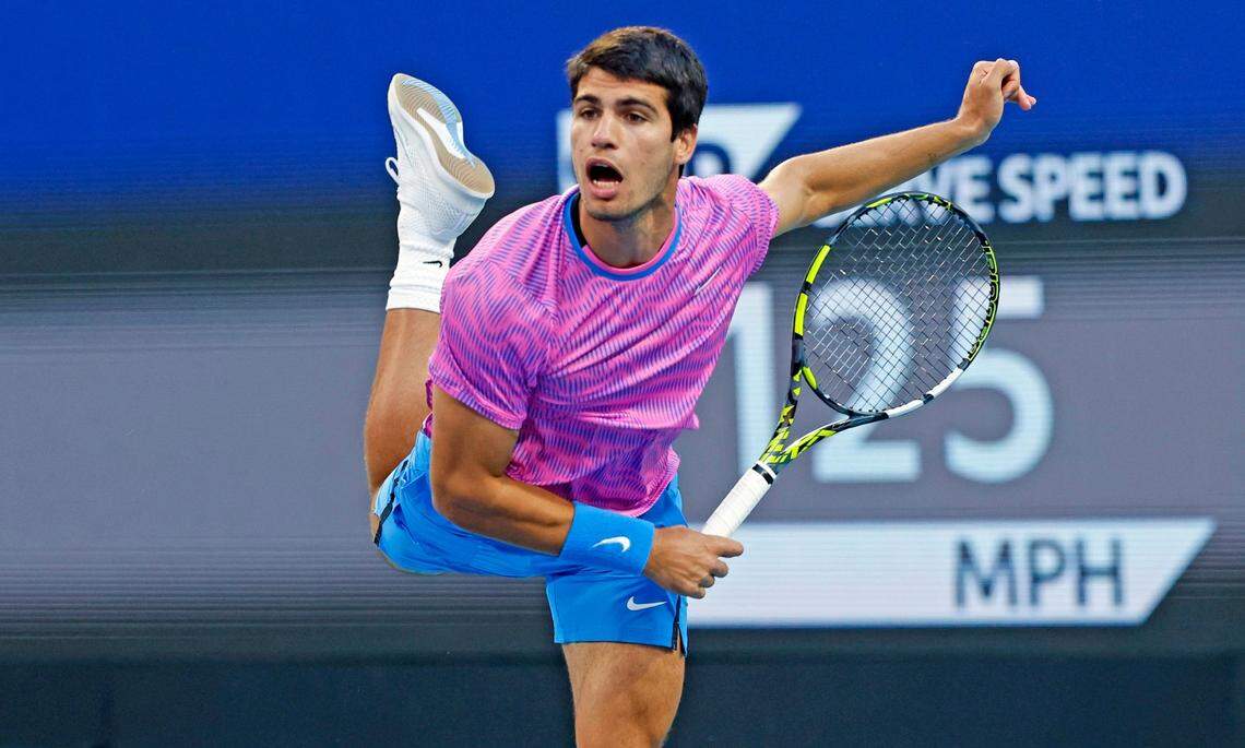 Carlos Alcaraz of Spain serves to Grigor Dimitrov of Bulgaria during the Miami Open Tennis Tournament at Hard Rock Stadium in Miami Gardens, Florida on Thursday, March 28, 2024.