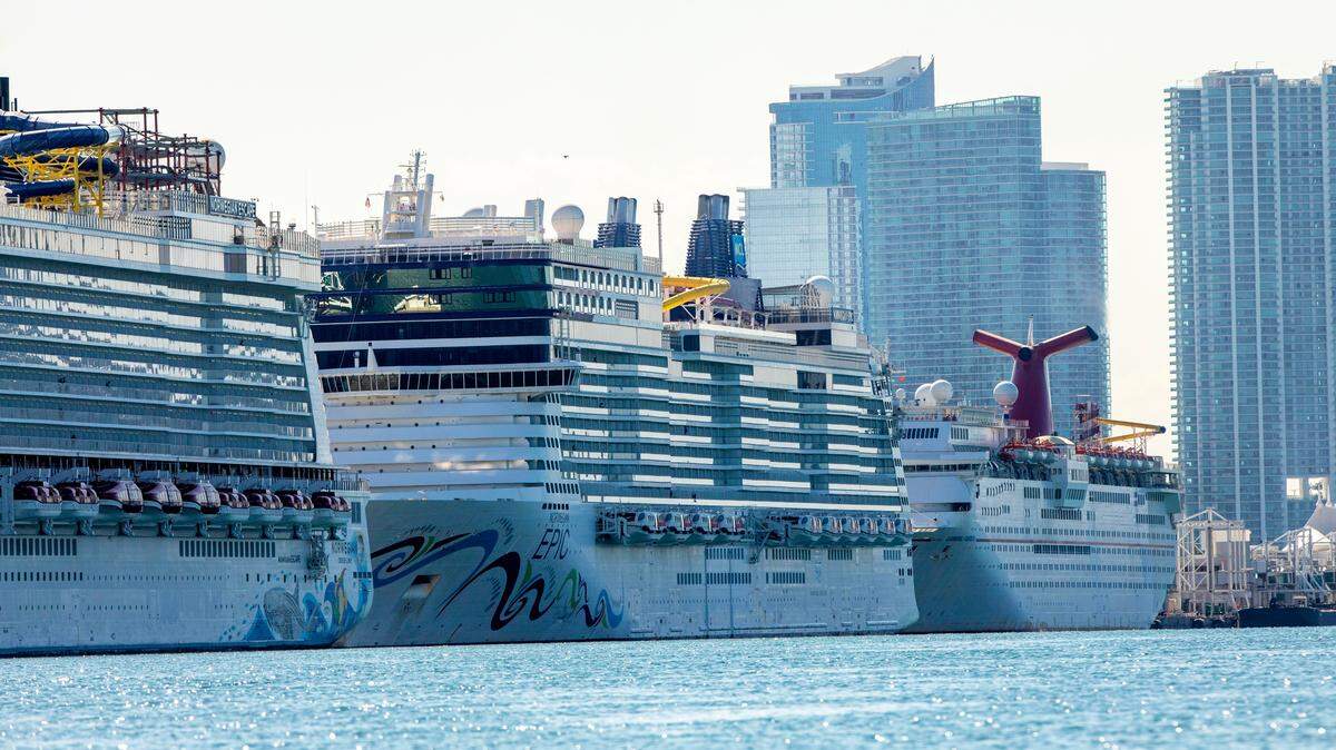 Cruise ships are docked and lined up at PortMiami in Miami, Florida on Monday, May 4, 2020 as the industry remains shut down during the COVID-19 pandemic.