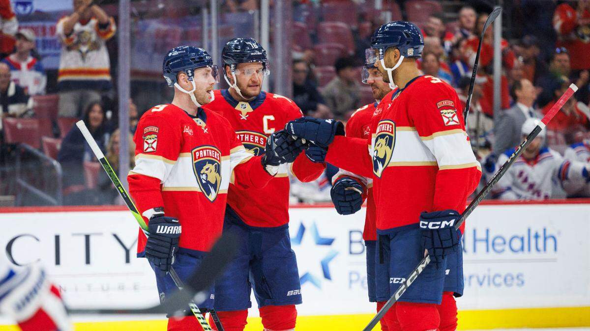 Florida Panthers center Sam Reinhart (13) celebrates his power play goal with teammates during the first period of a game against the New York Rangers on Monday, April 14, 2025, at Amerant Bank Arena in Sunrise, Fla.