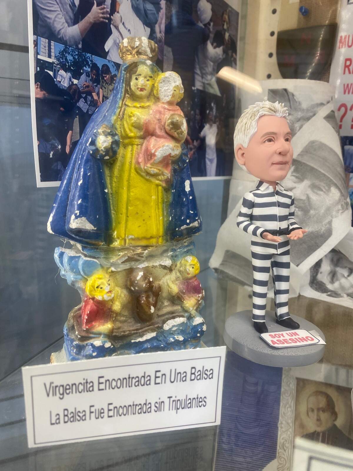 IMG_6690 (1).jpg An image of the Virgin of Charity found on an empty raft, symbolizing the exodus of rafters who leave Cuba in flimsy vessels and never reach the shores of Florida. To the right, an image of Cuba’s unelected leader, Miguel Díaz-Canel, who is responsible for the intensification of repression on the island.