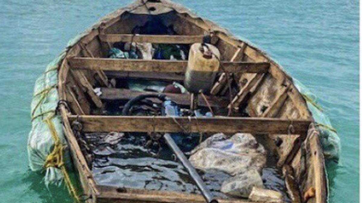 A boat that ferried seven Cubans to the Florida Keys floats in Boot Key Harbor in the city of Marathon Tuesday, Jan. 12, 2021.