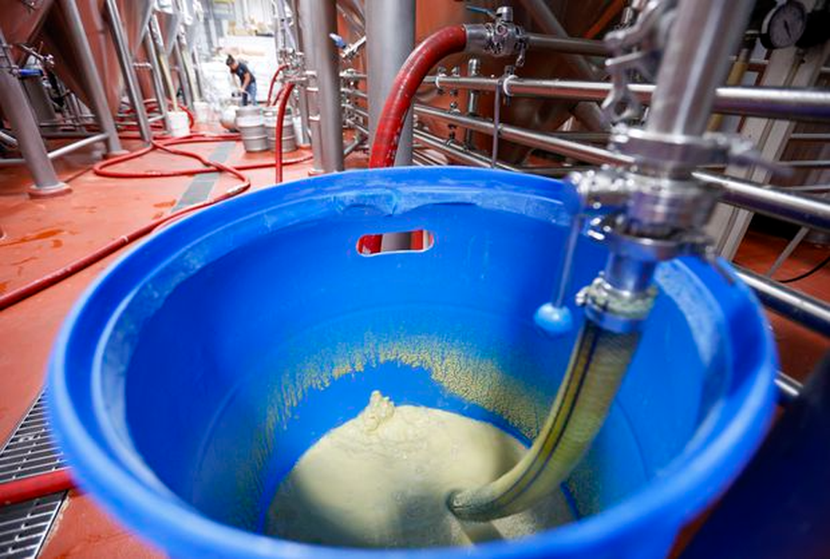Gas escapes from a barrel next to a fermenter at Big Storm Brewing Co. on Feb. 21 in Clearwater. Big Storm has implemented a system to capture carbon dioxide typically released in the brewing process.