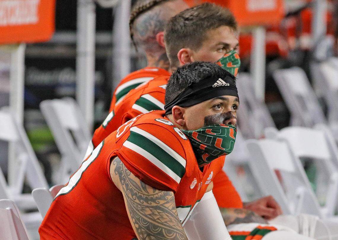 UM’s kicker Jose Borregales (30) wears a mask on the sideline as the University of Miami hosts the UAB Blazers at Hard Rock Stadium in Miami Gardens on Thursday, September 10, 2020.