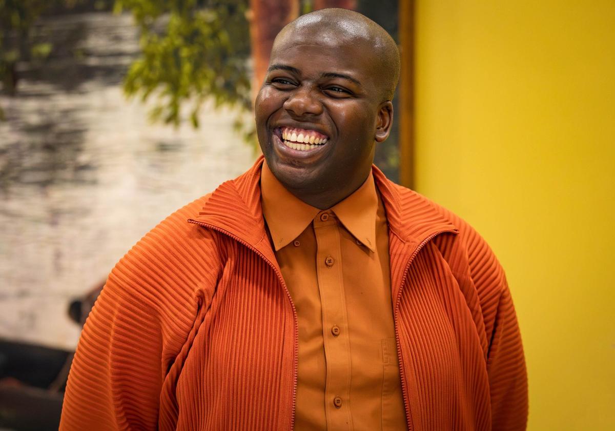 Cornelius Tulloch presents and explains his work to a crowd of guests before his solo show opening party at the Andrew Reed Gallery on Thursday, July 11, 2024 in Miami, Fla.