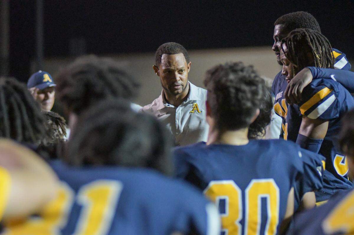 St. Thomas Aquinas football coach Roger Harriott talks to his team after beating Coconut Creek in a Region 3-3M quarterfinal game on Friday, Nov. 11, 2022, at St. Thomas Aquinas High School in Fort Lauderdale, Florida.