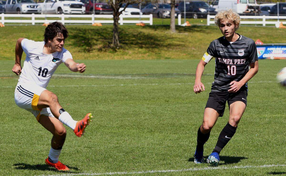 Downtown Doral junior Jose Uzcategul (10) drills a game-tying goal into the net during the first half of the FHSAA Class 3A state championship game against Tampa Prep on Saturday at Lake Myrtle Park in Auburndale. The goal tied the game 1-1.