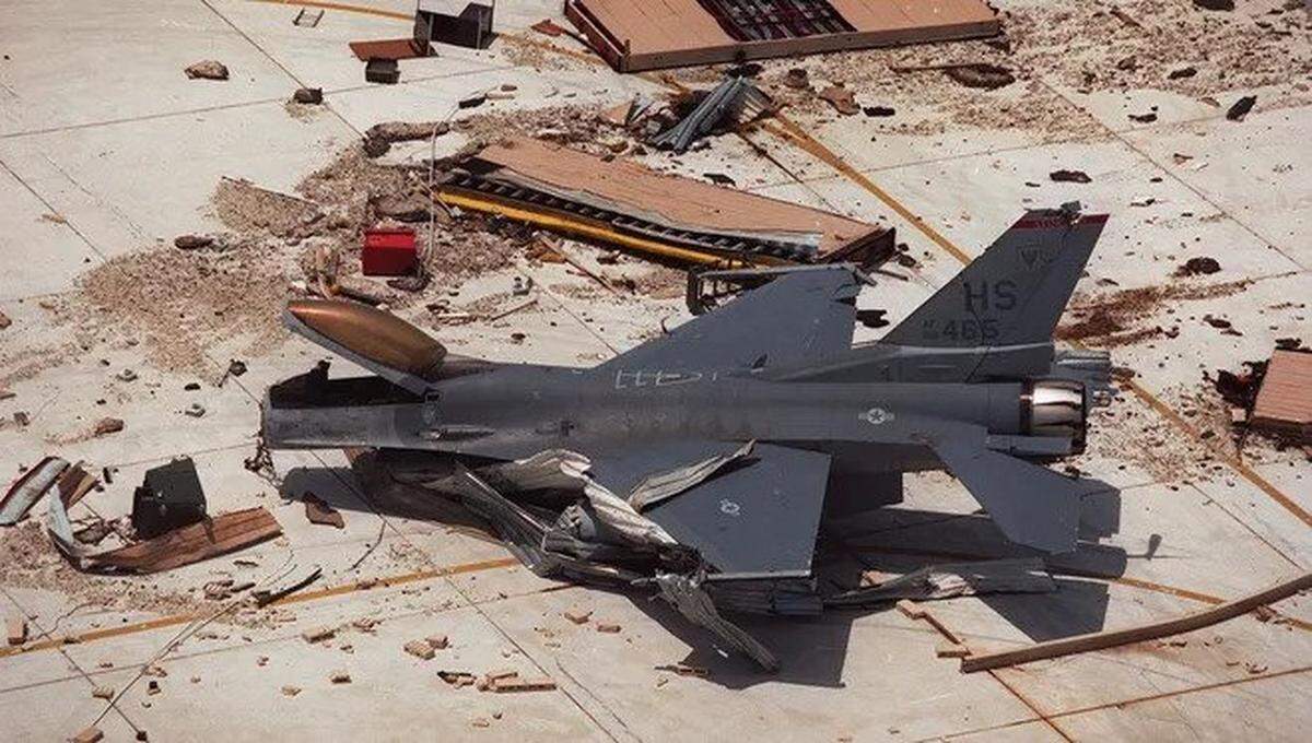 An F-16 fighter jet sits amid the rubble at Homestead Air Force base after Hurricane Andrew blew through in August 1992.