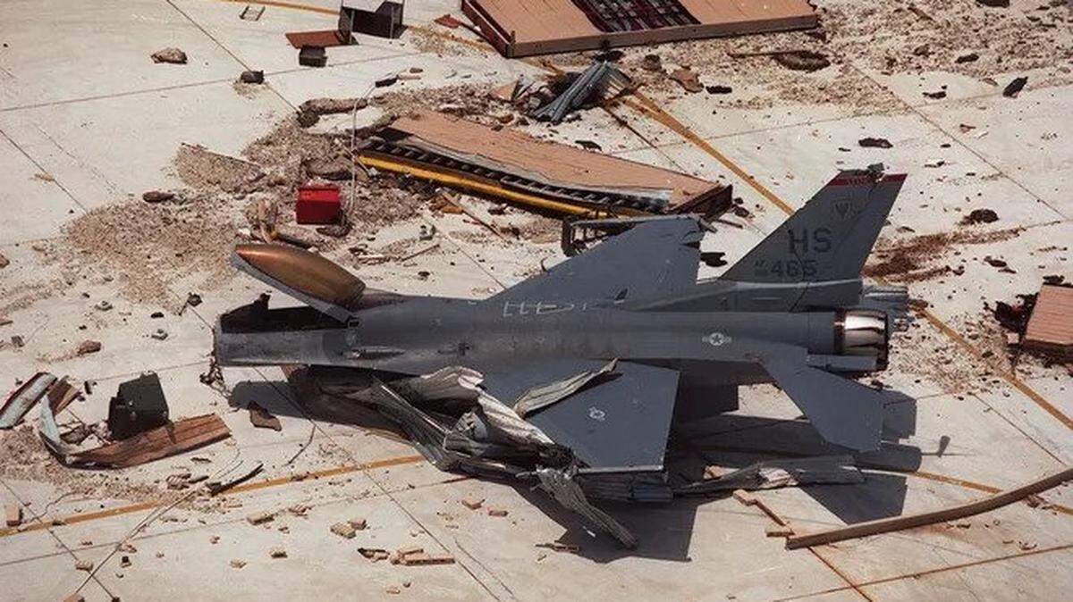 An F-16 fighter jet sits amid the rubble at Homestead Air Force base after Hurricane Andrew blew through in August 1992.