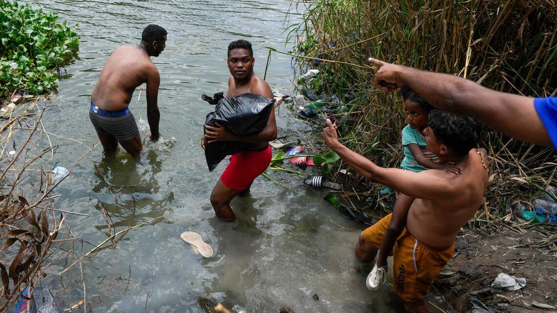 Migrants cross the Rio Grande to the U.S. side, from Matamoros, Mexico, Thursday, May 11, 2023.